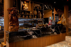 Wood brown flexible slat wall panels installed on a curved restaurant counter in Vaughan