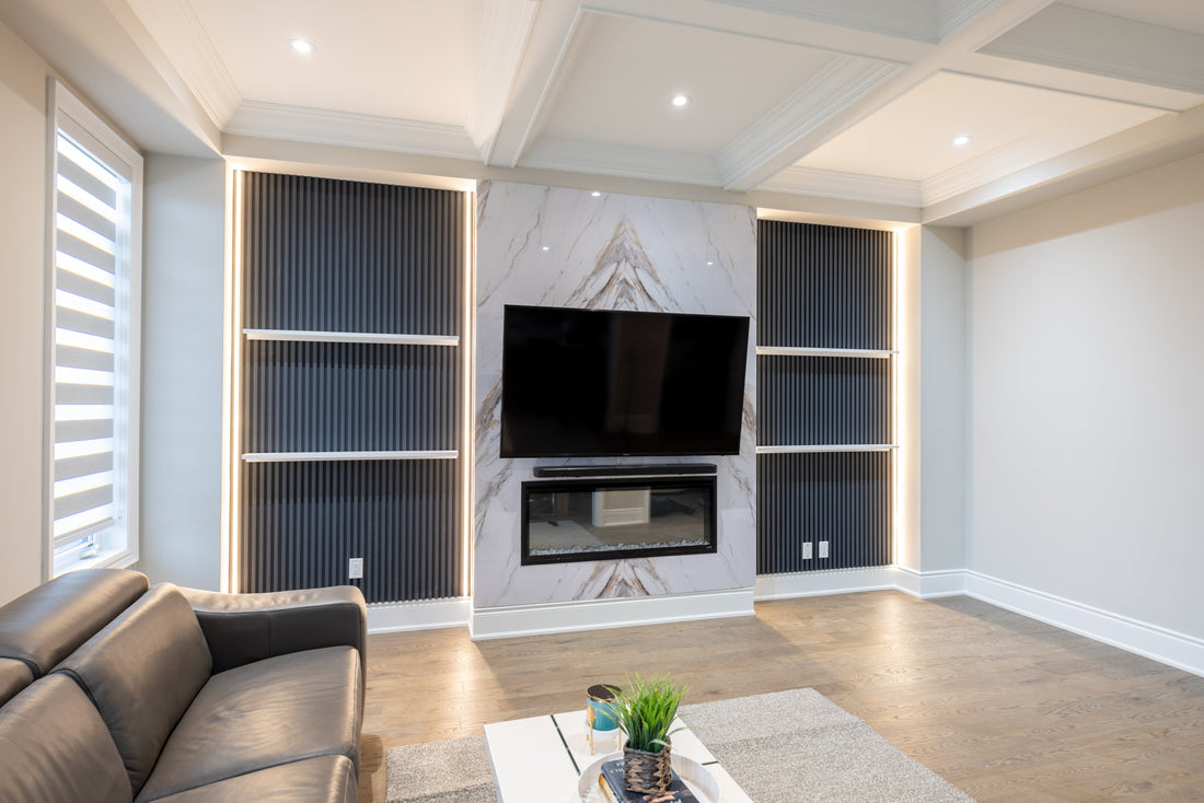 Marble wall panel fireplace with matte gray slat wall panels in Pickering home