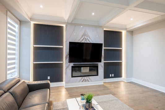 Marble wall panel fireplace with matte gray slat wall panels in Pickering home