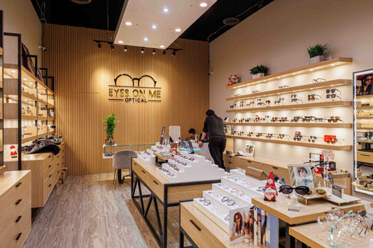 Optical store interior with Natural Oak slat wall panels forming a logo background wall