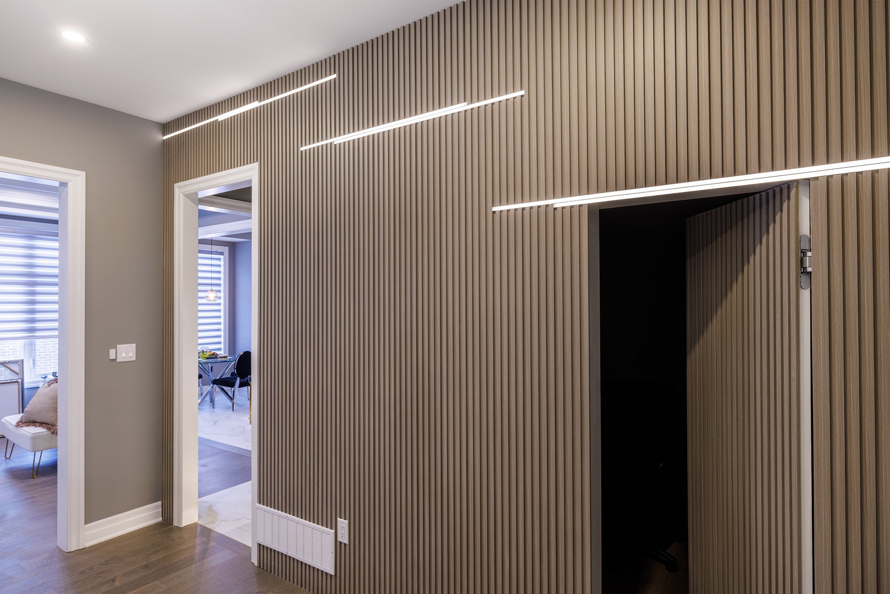 RichVaugh Dark Gray slat wall detail with custom television panel and concealed lighting in Markham