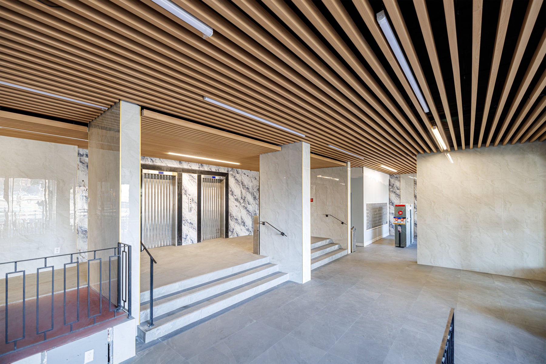 Commercial Natural Wood ceiling wall panel detail in a Scarborough condo common area