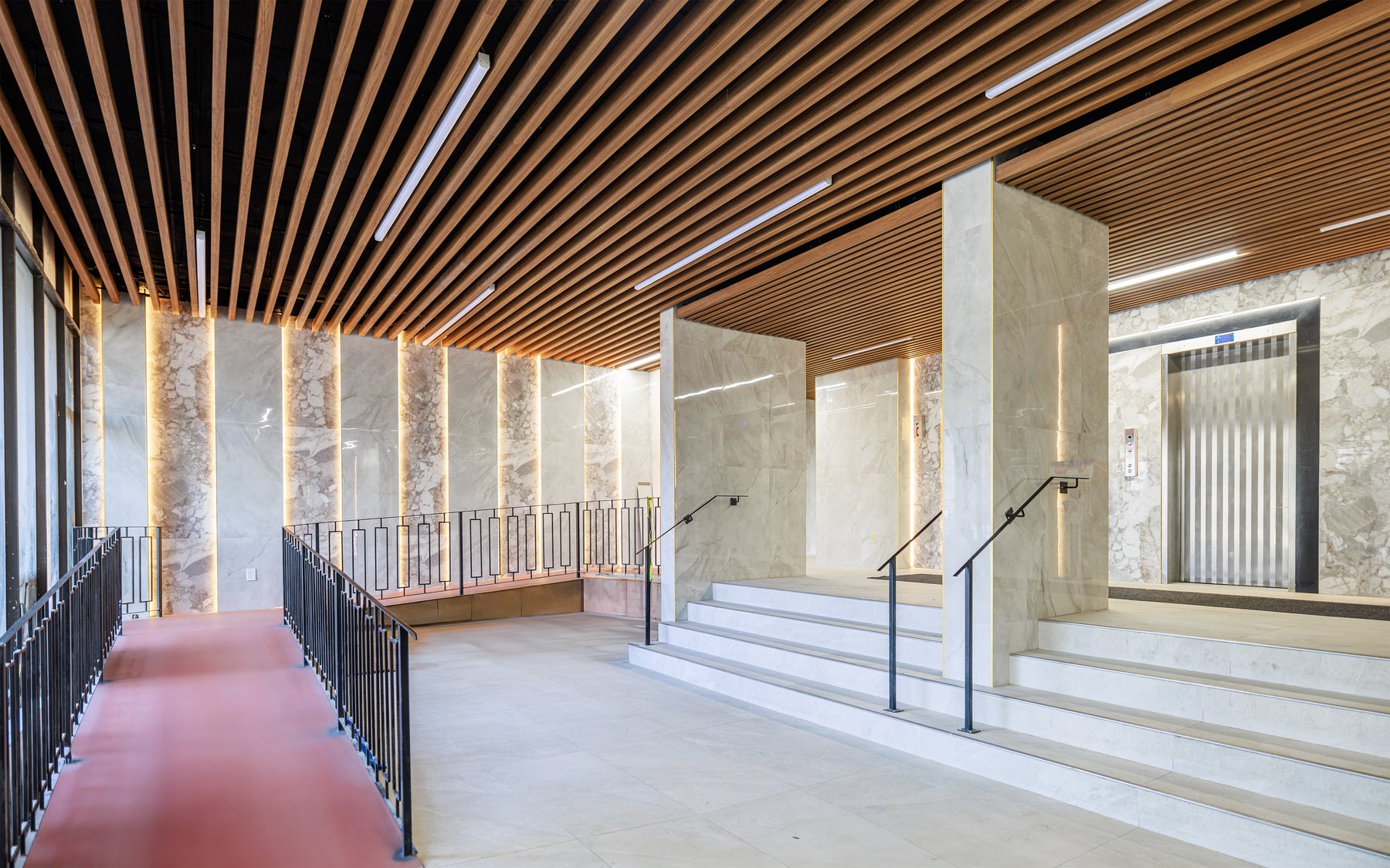 Wood Brown ceiling panels installed through a Scarborough condo lobby transition area