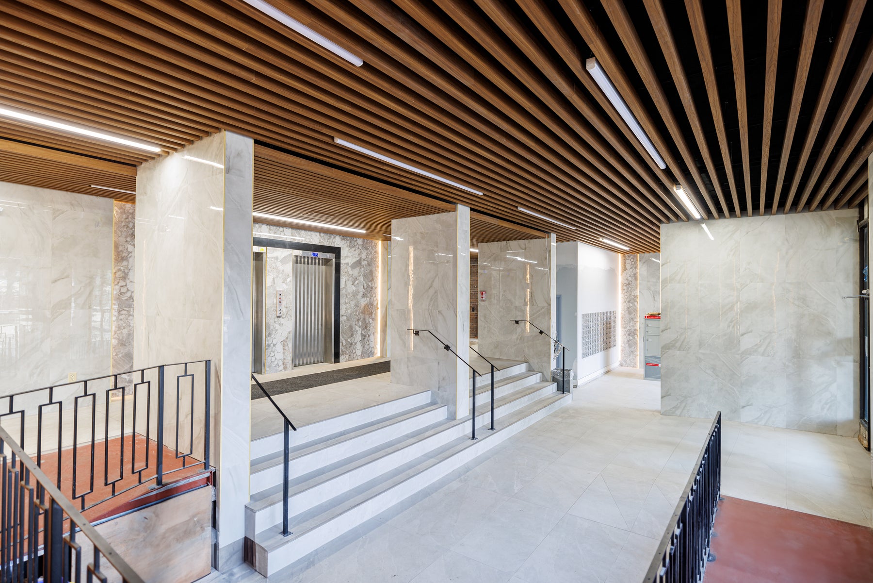 Natural Wood and Wood Brown ceiling panels across a renovated condo lobby in Scarborough by RichVaugh