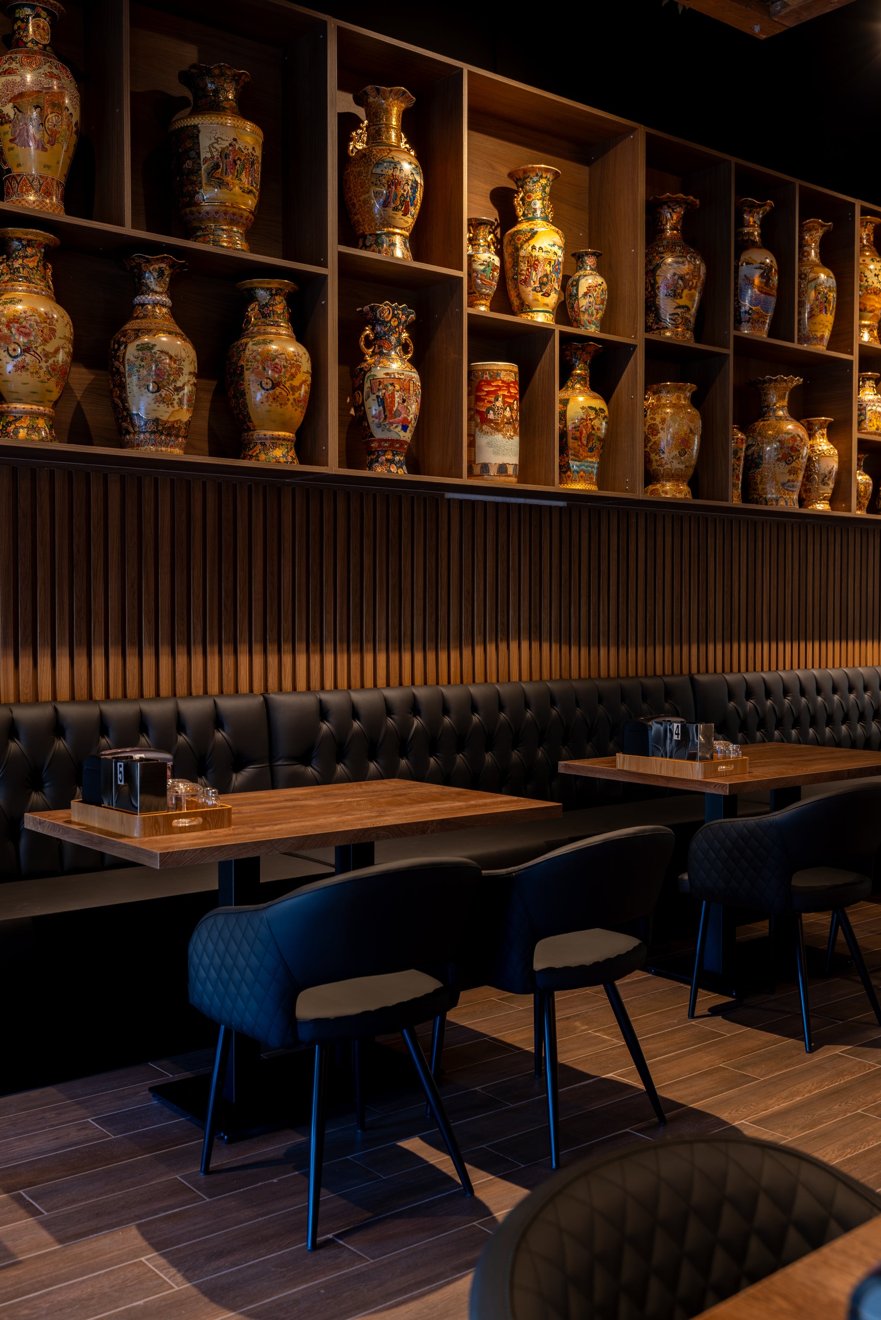 Wood Brown 190 slat panels installed below custom display shelves in a Markham Vietnamese restaurant