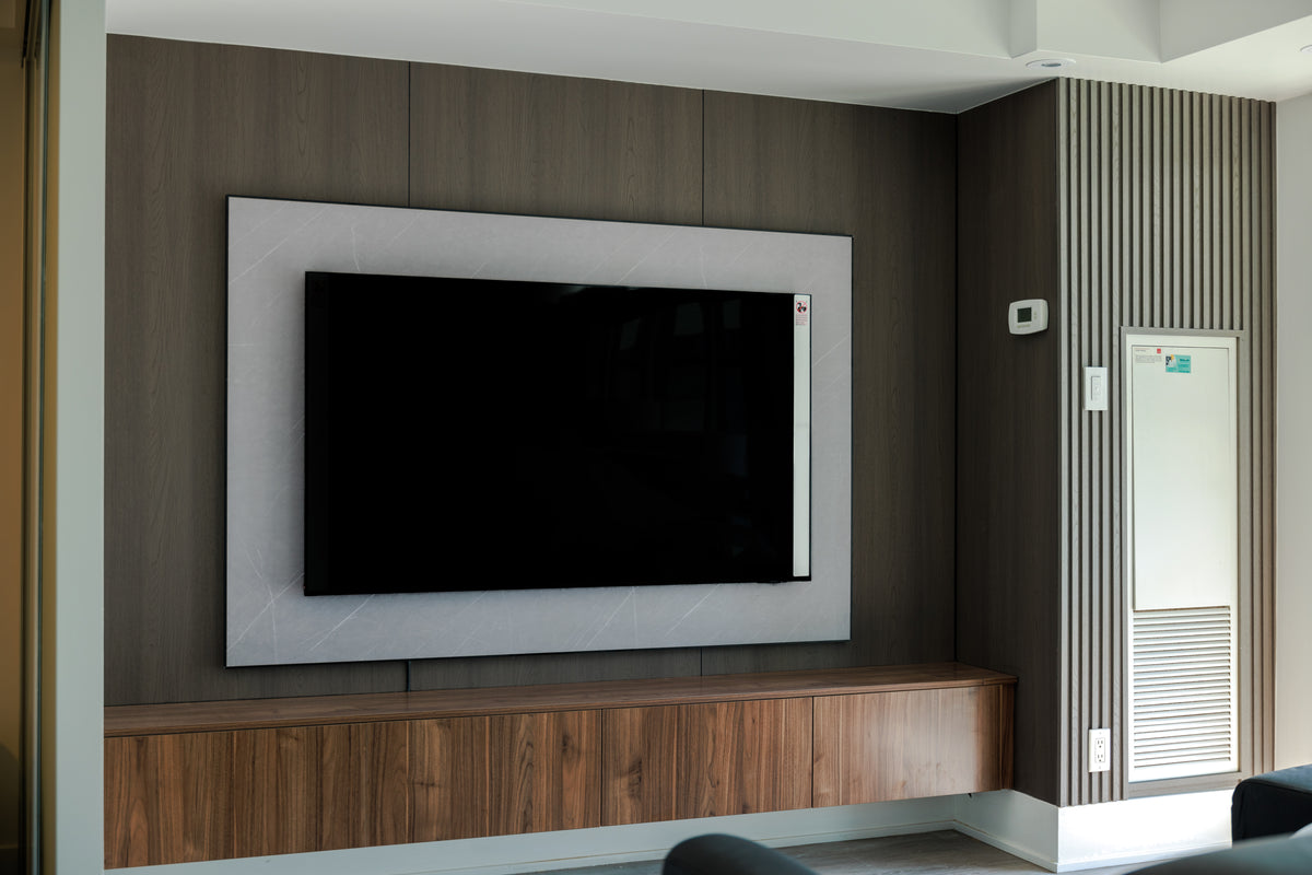 Layered gray panel and slat TV wall in Downtown Toronto by RichVaugh