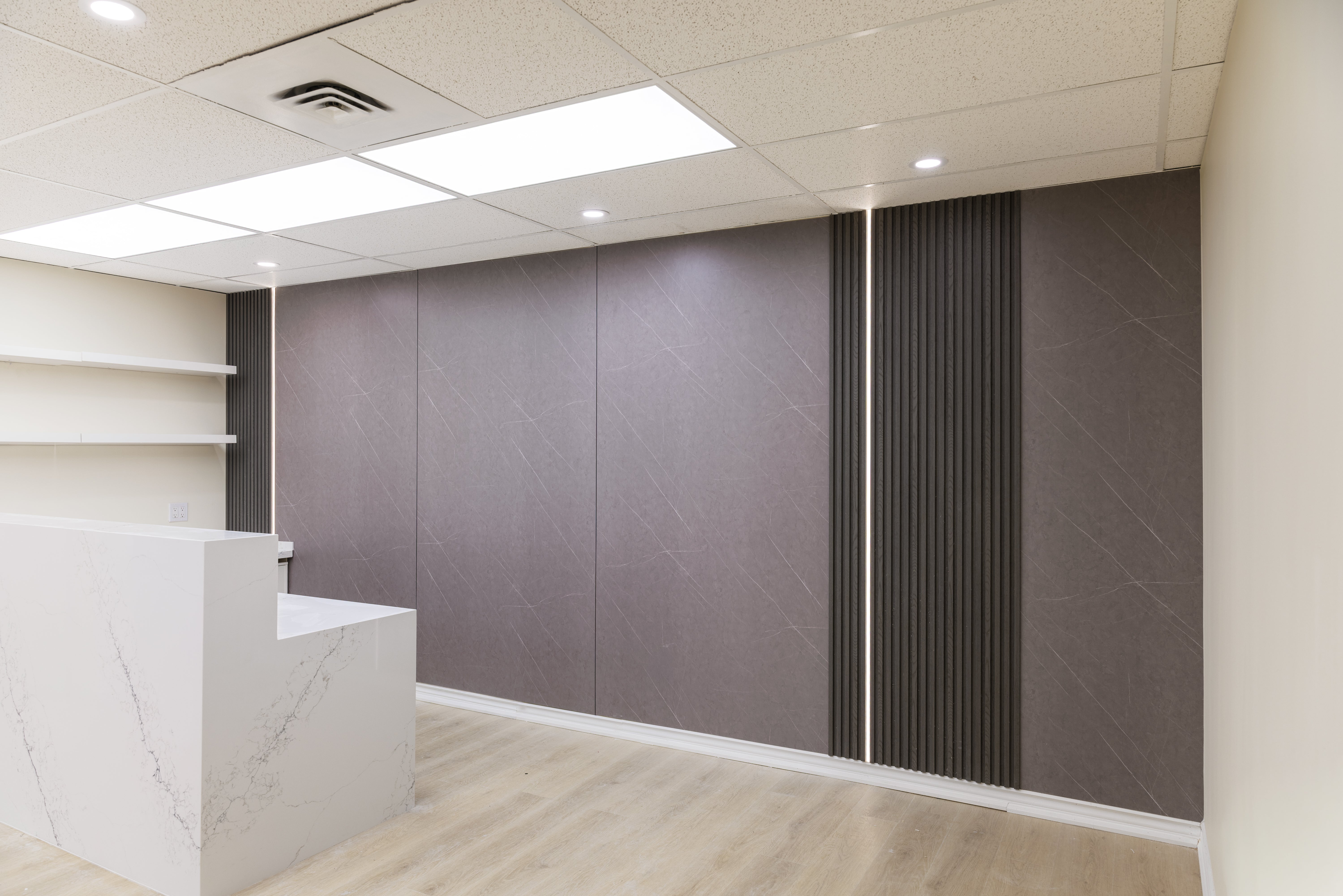 Interior slat wall panels installed with wall panels