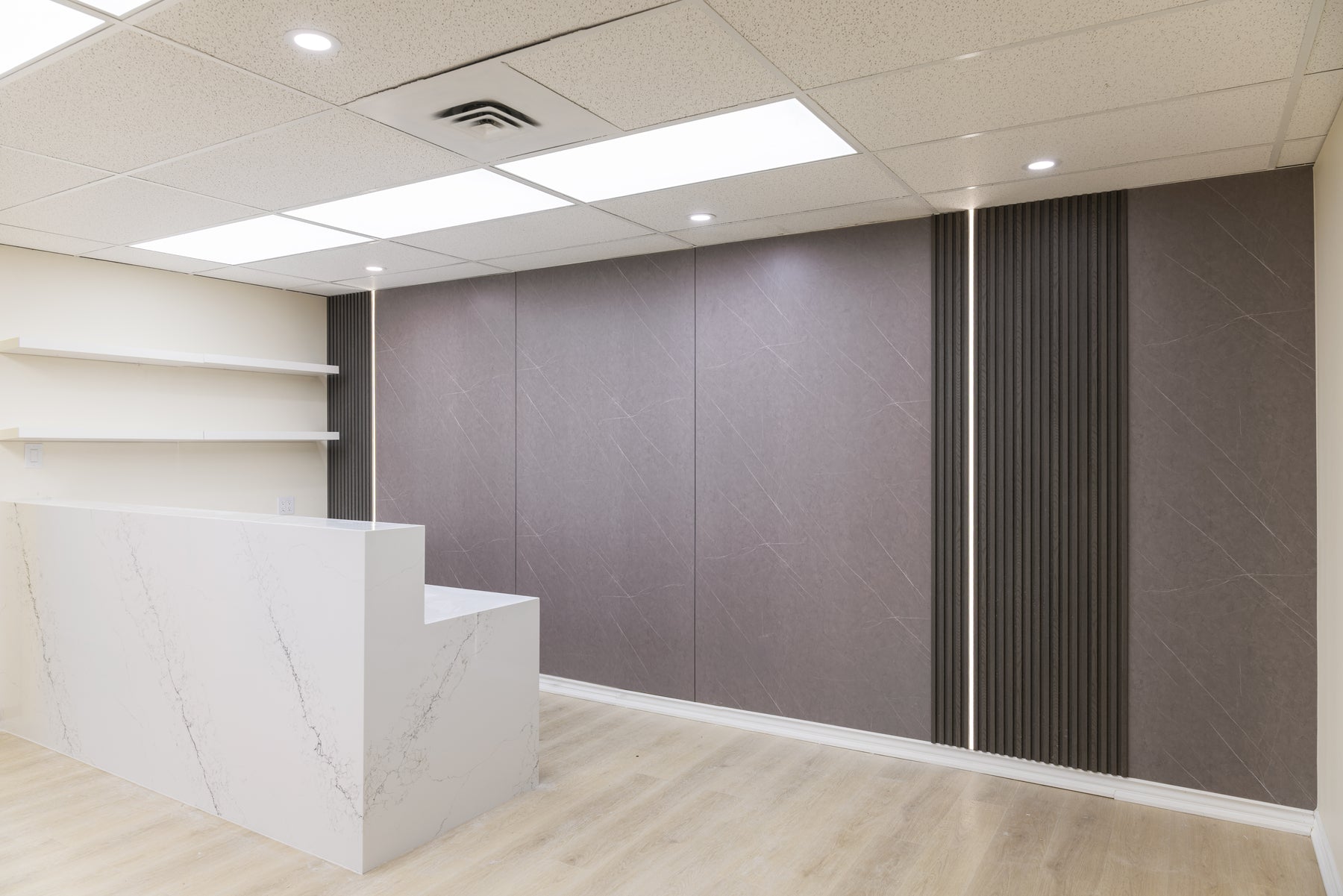 Stone Gray large wall panels and Smoke Dark Gray slat panels with LED lighting in a Richmond Hill tutoring centre office by RichVaugh