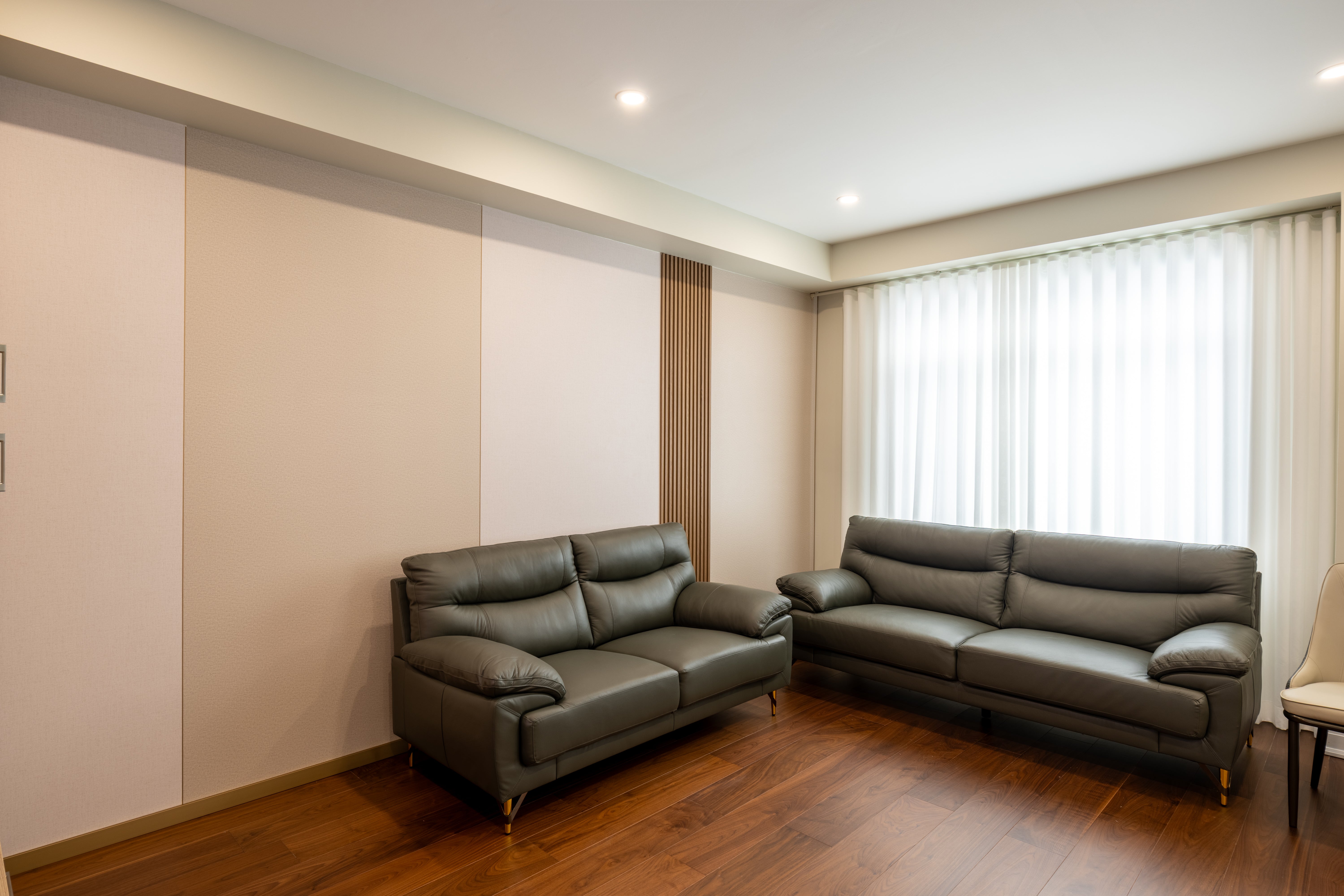 Grasscloth wall panels installed on a living room feature wall