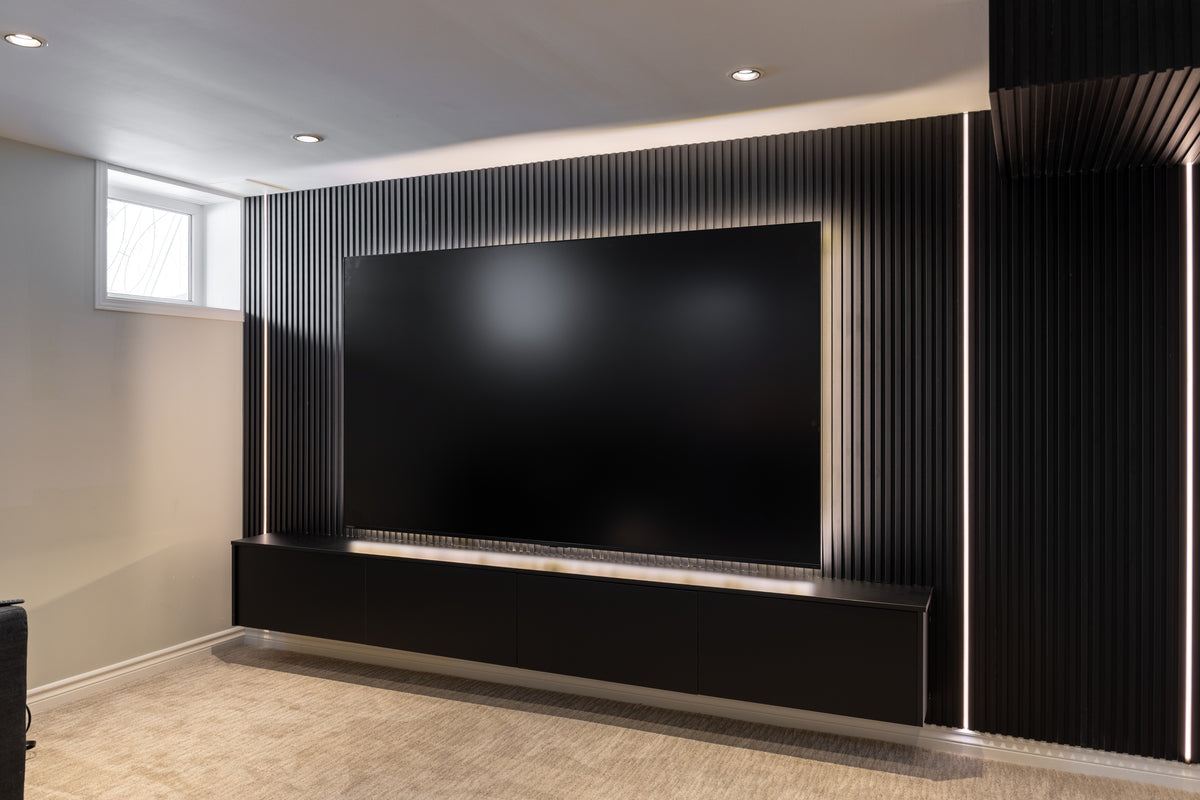 Matte black slat TV wall with hidden lighting in Vaughan by RichVaugh