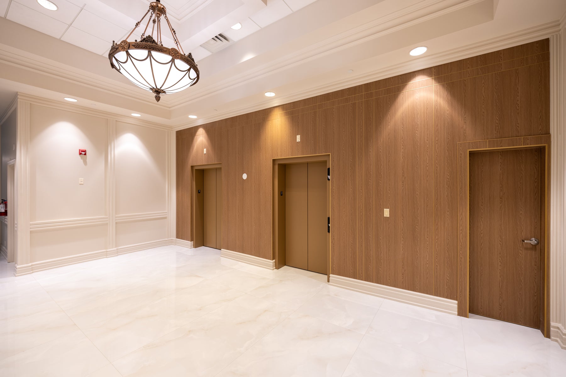 Commercial oak and marble wall panel installation in the main hall of a Vaughan wedding venue by RichVaugh