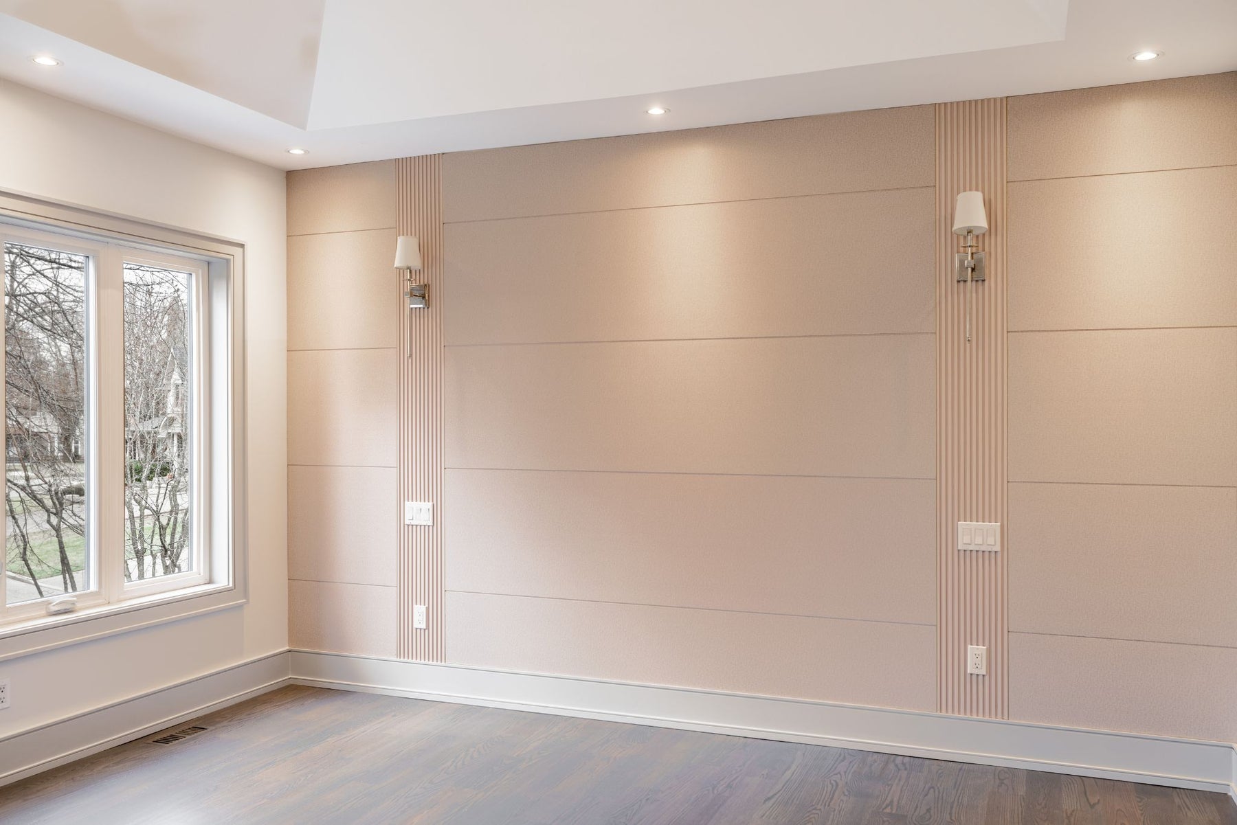 Wide view of a custom RichVaugh media wall and built-in storage in a Unionville house