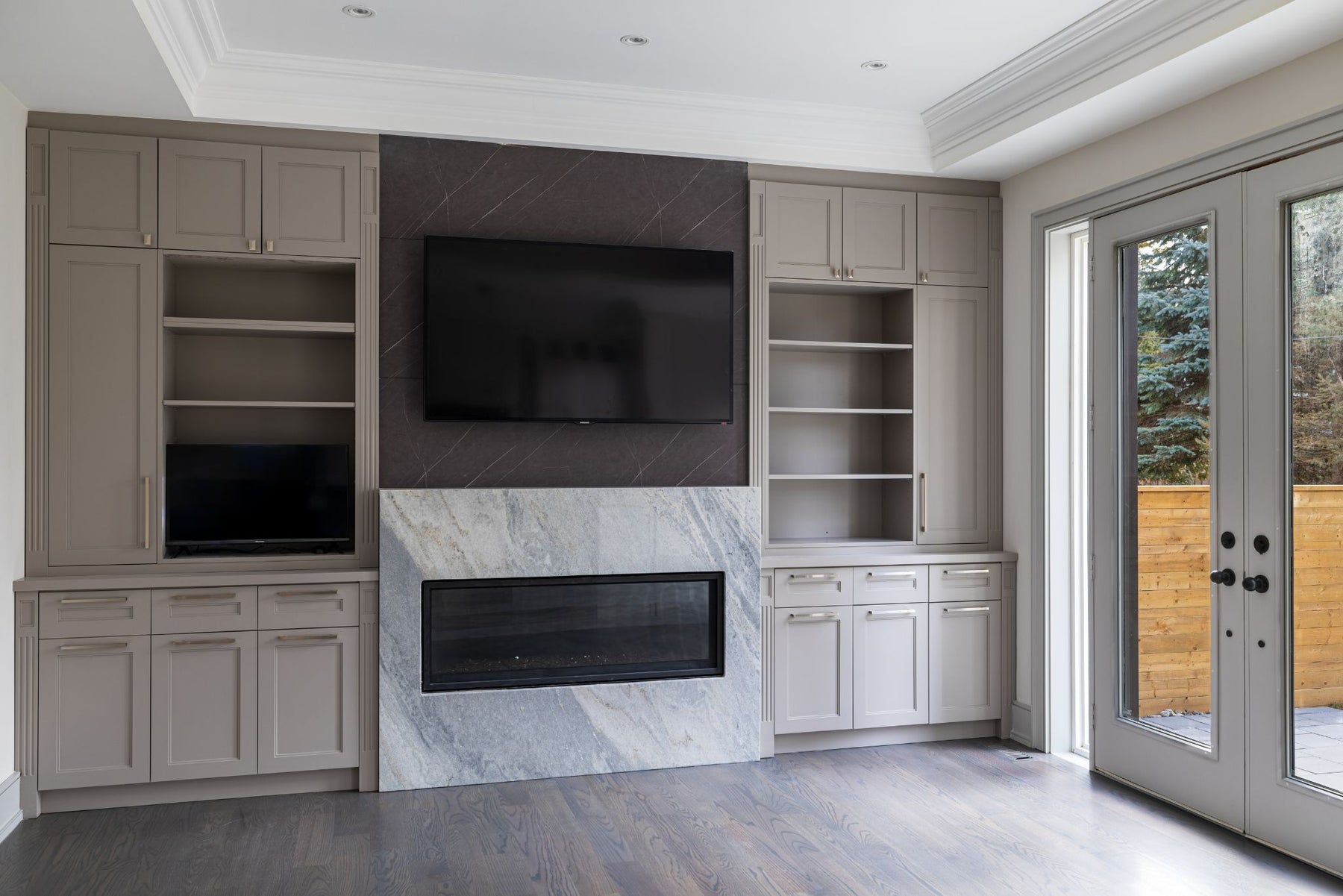 Alternate view of a RichVaugh Stone Gray 1 fireplace TV wall with built-in cabinetry in Unionville Ontario