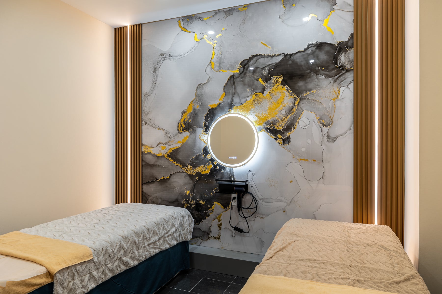 Marble Wall Panel 8 and Metal Gold slat wall panels behind massage beds in a Markham spa