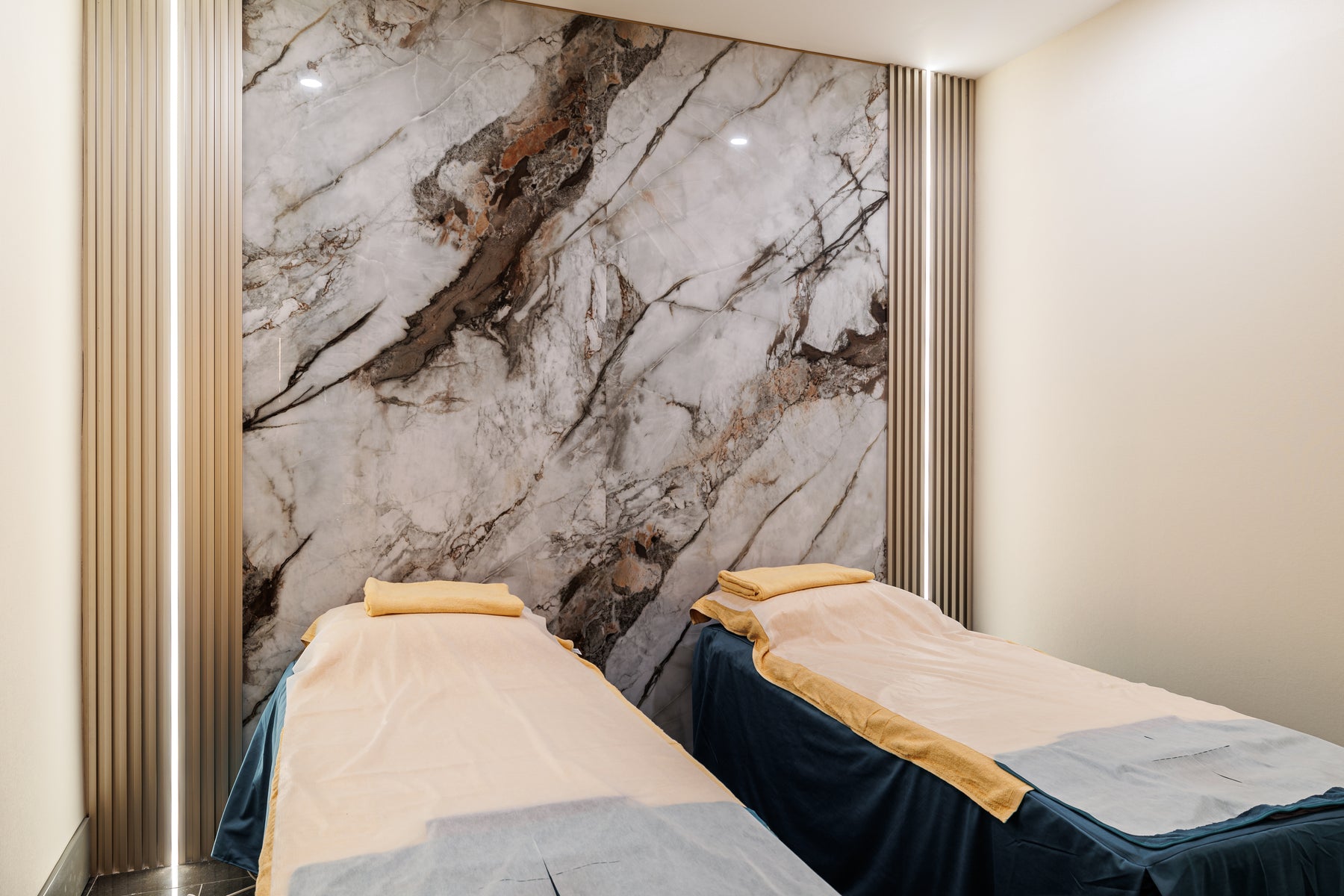 Marble Wall Panel 2 and Metal Gold slat accents in a spa massage room in Markham Ontario