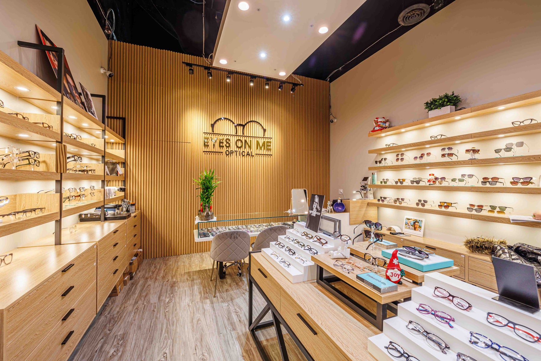 Natural Wood slat wall panel feature wall in a Markham optical store by RichVaugh
