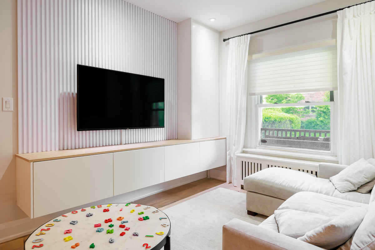 China White slat wall panel TV feature wall with floating console in Toronto Ontario by RichVaugh