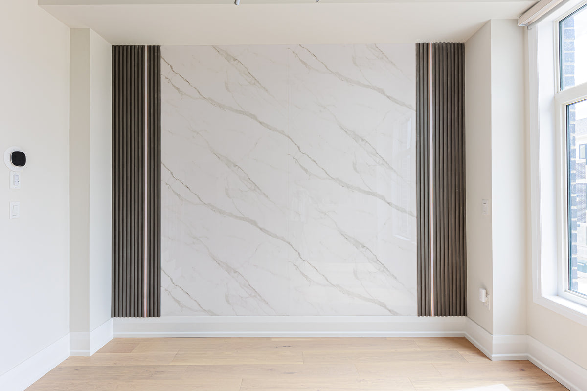 Marble and dark gray slat feature wall in Richmond Hill by RichVaugh