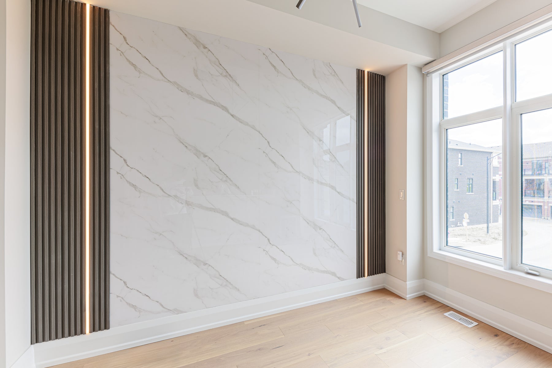 Wide view of a RichVaugh Dark Gray slat and marble feature wall in a Richmond Hill house