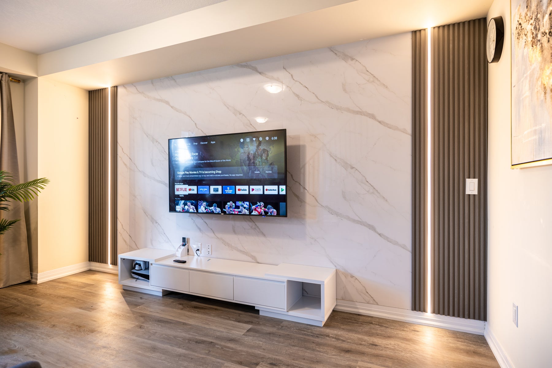 Alternate view of a completed RichVaugh Marble Wall Panel 5 and Dark Gray slat TV wall in Hamilton Ontario