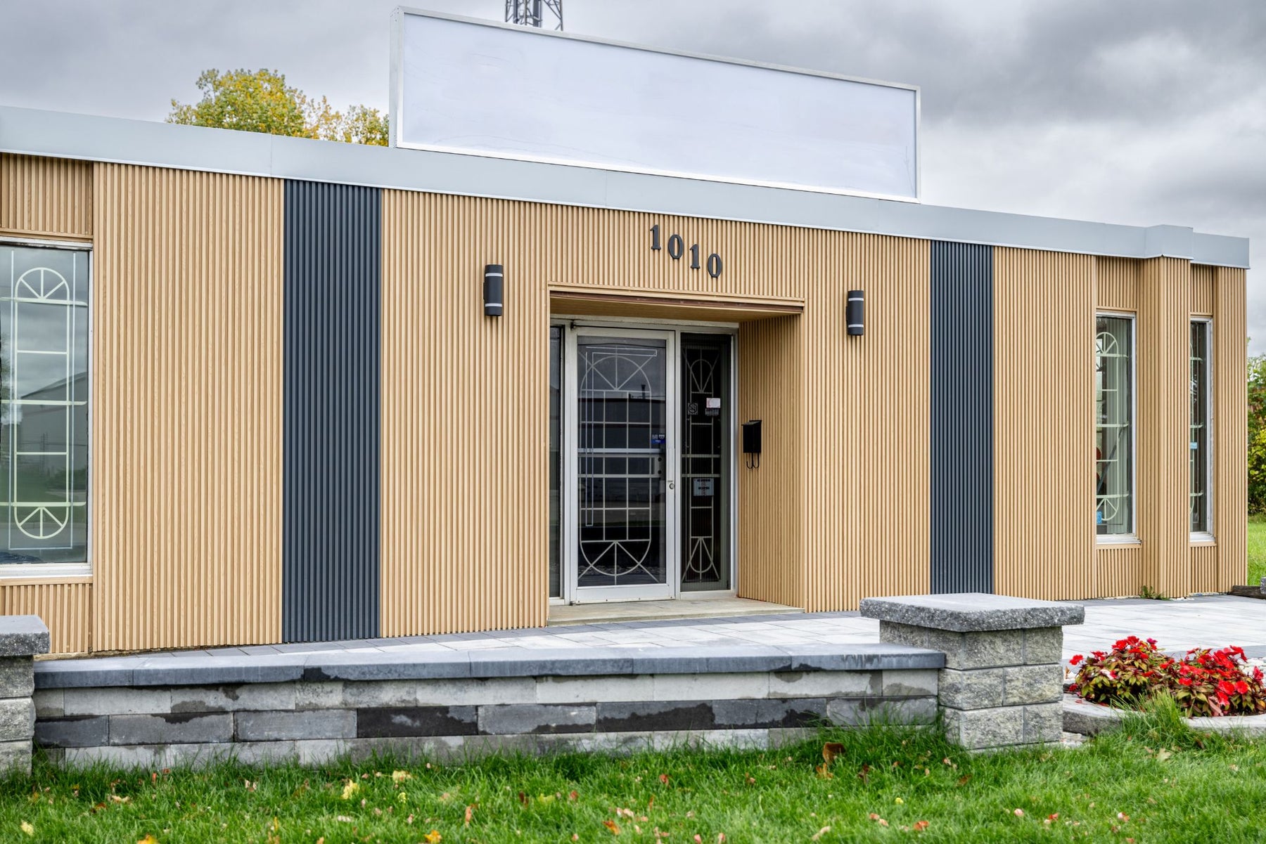 Natural Wood and Matte Gray exterior slat wall panel siding on a commercial building in London Ontario by RichVaugh