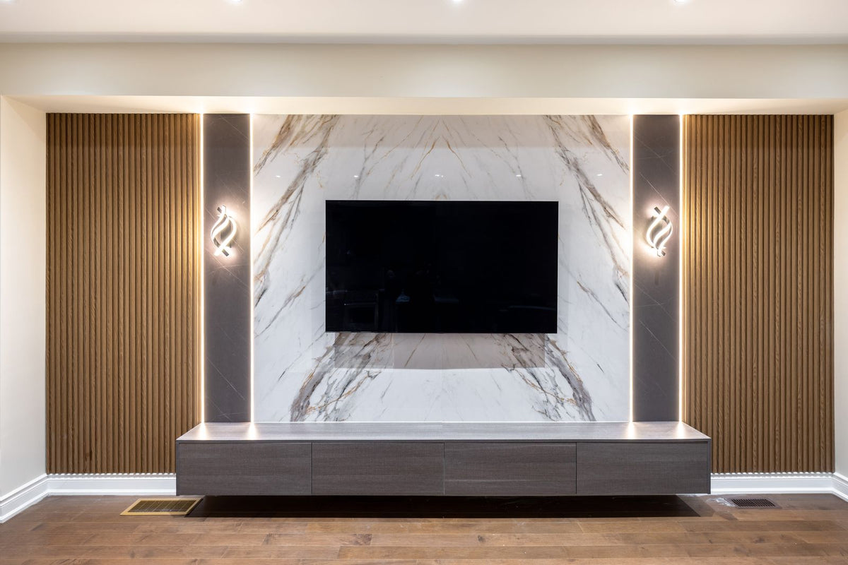 Front view of RichVaugh marble, stone gray and wood oak slat TV wall with LED lighting in Alliston Ontario