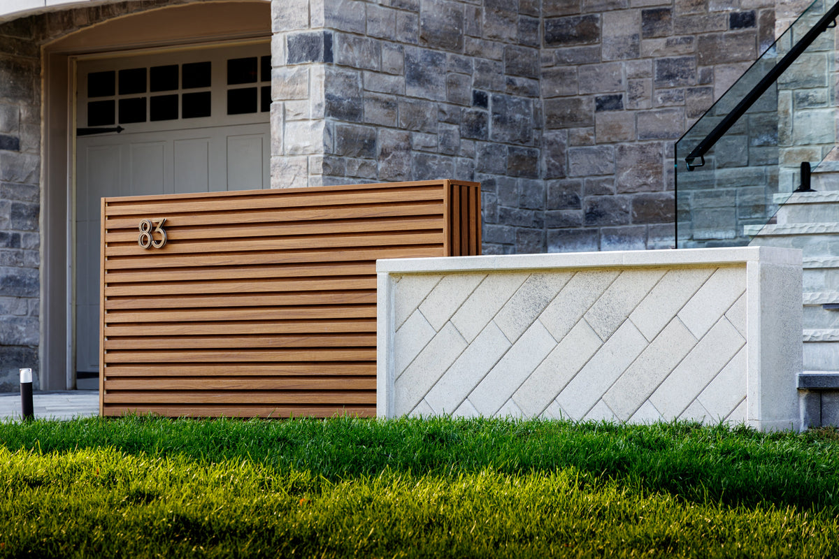 Front view of a horizontal brown slat address wall beside a decorative screen and lawn in Markham.