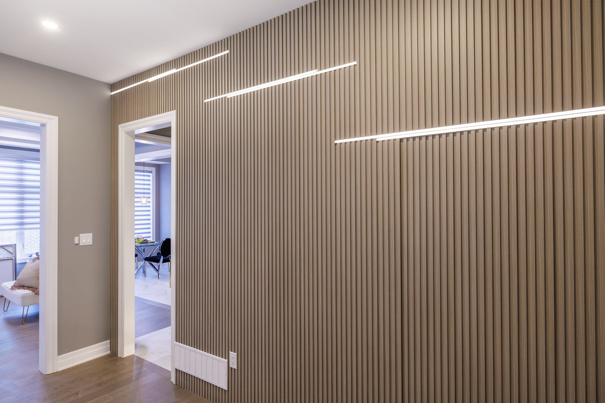 Close view of hallway slats and narrow linear lights above a doorway in Markham.