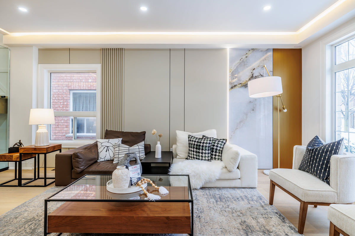 Living room with pale gray panels, slats and a marble-look accent in Markham.