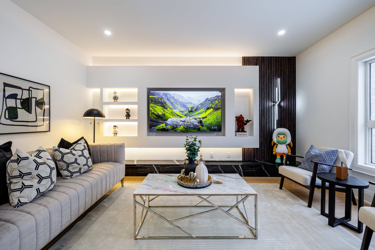 Markham TV wall with display niches, a dark slat side panel and concealed lighting.
