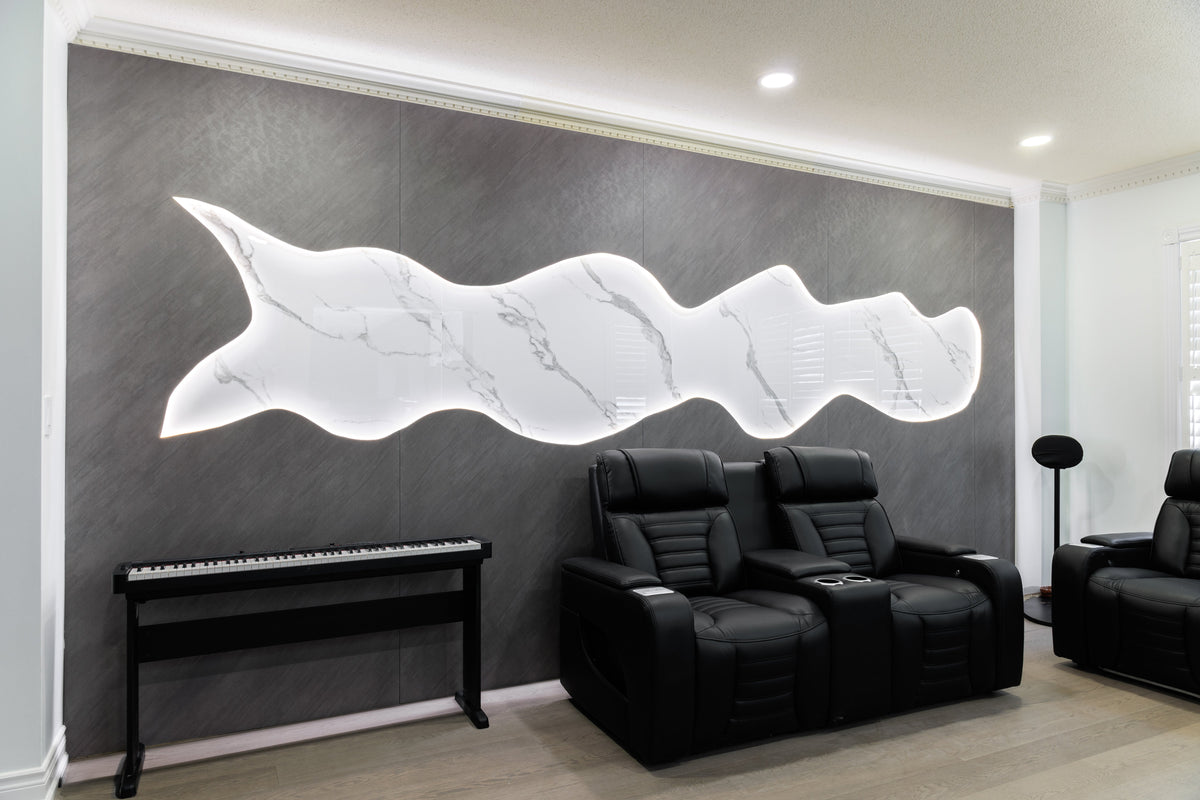 Gray living room feature wall with a backlit white sculptural accent and black recliners in Markham, Ontario.