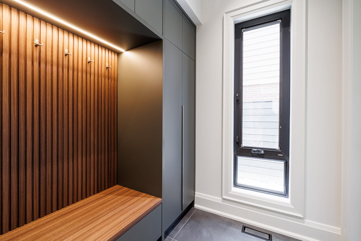 Built-in bench with illuminated vertical wood-tone slats and gray side panels in North York.