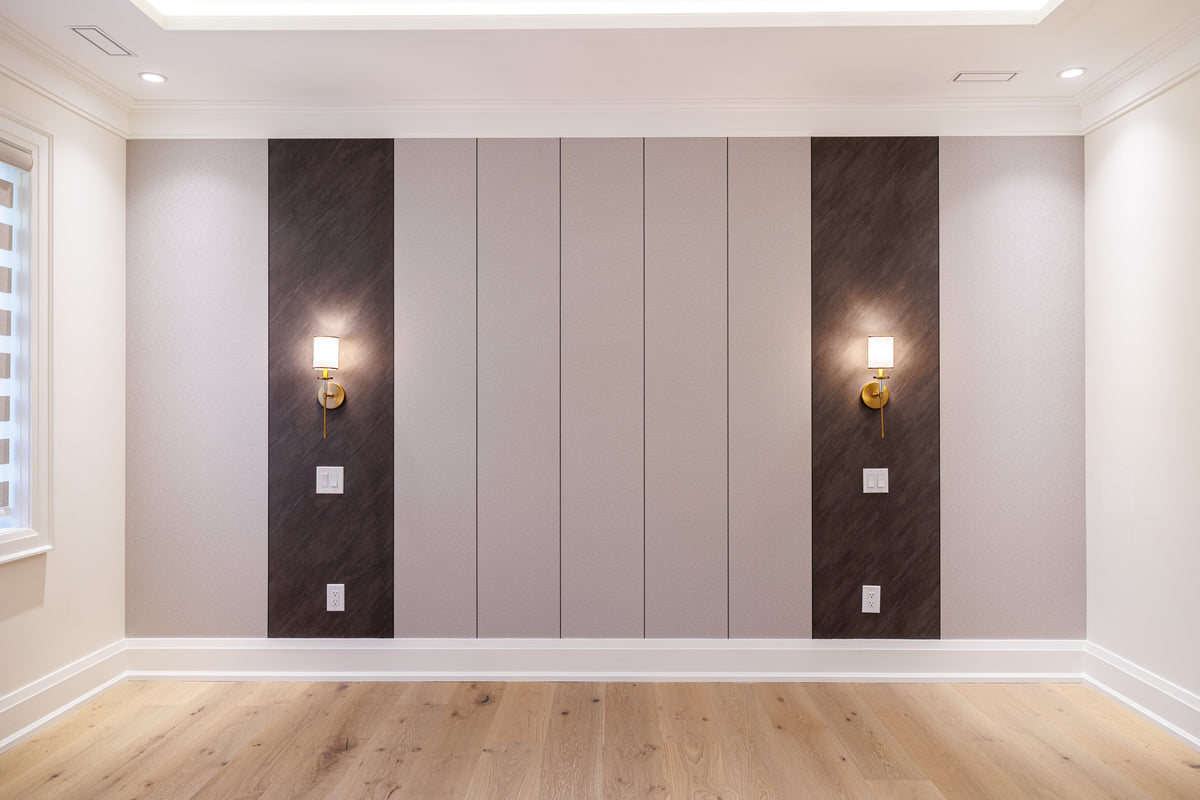 North York custom home wall with broad neutral panels, dark vertical sections and paired wall sconces.