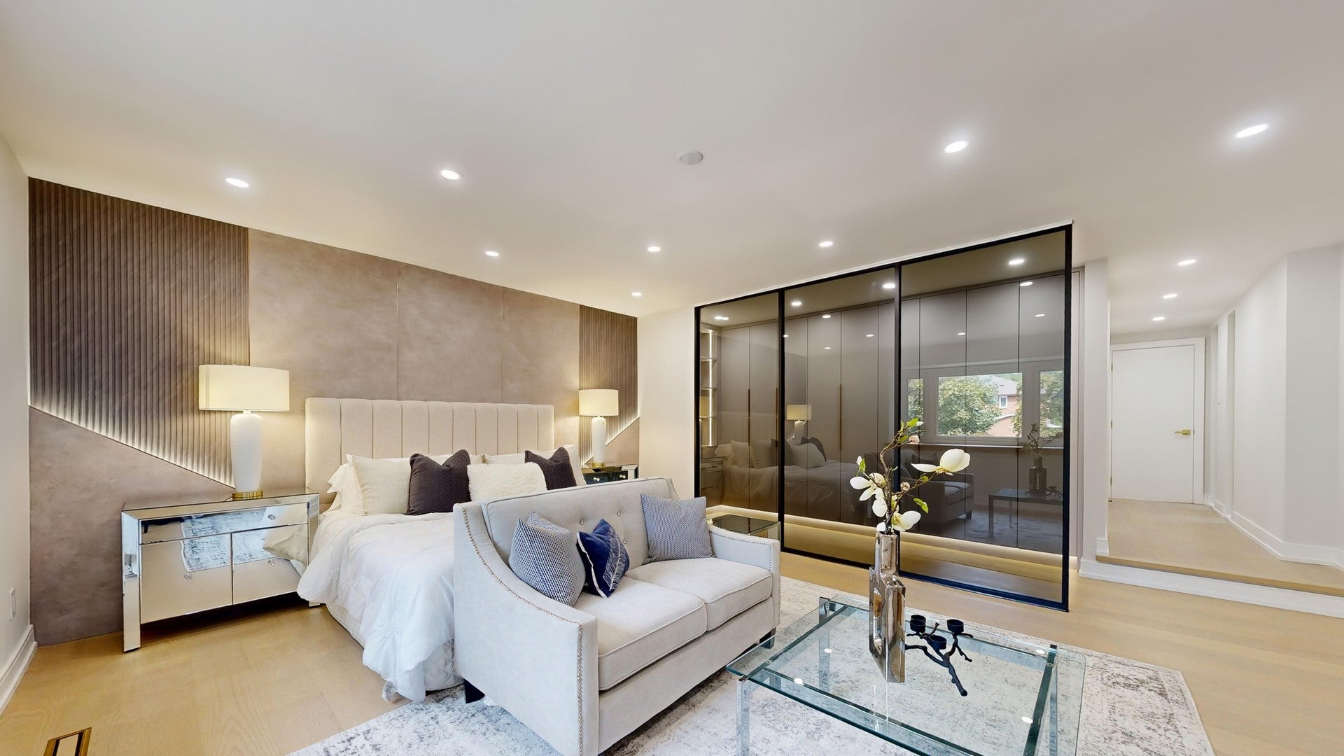 Modern bedroom feature wall with fluted and textured wall panels in a renovated home in Richmond Hill, Ontario.