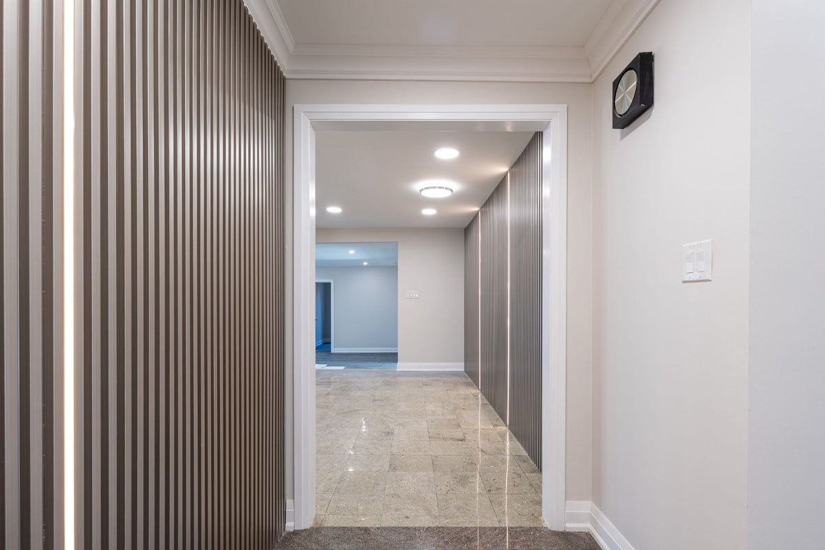 Richmond Hill hallway with silver-gray slat panels along the wall and pale flooring.